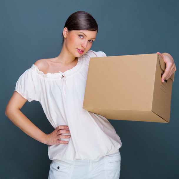 Closeup portrait of a young woman with box - Foto, Imagen