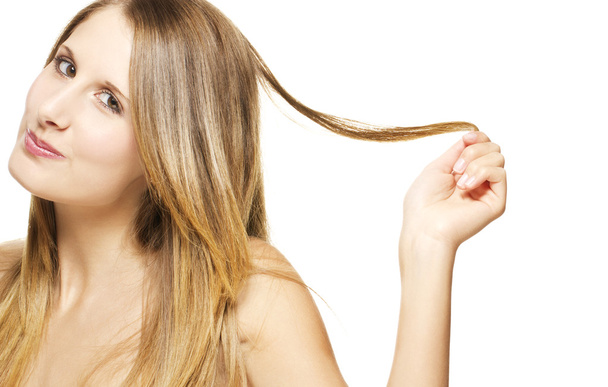 Beautiful cheeky woman playing with her hair - Zdjęcie, obraz