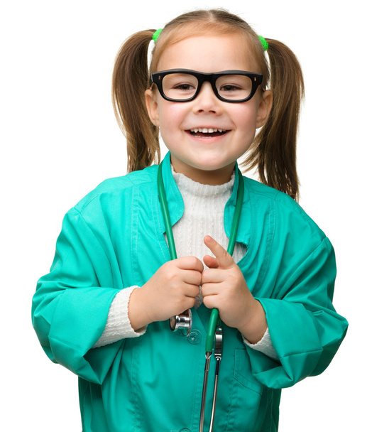 Cute little girl is playing doctor - Foto, imagen