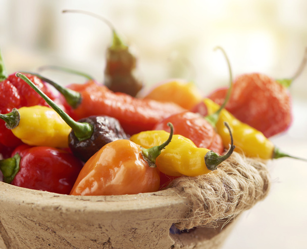 hot pepper mix photographed in a stone basket - Photo, Image