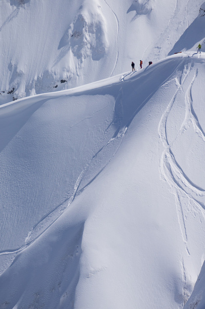 Snowboard freeride, snowboarders and tracks on a mountain slope. Extreme winter sport. - Photo, image