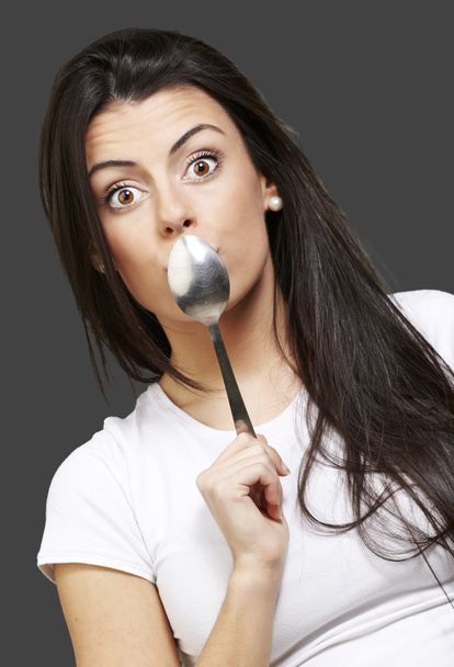 Woman holding a spoon - Photo, Image