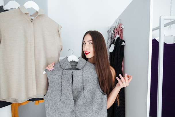 Woman choosing cloth in store - Foto, immagini