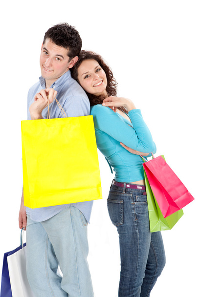 young beautiful couple in love with shop bag isolated on white - Фото, зображення