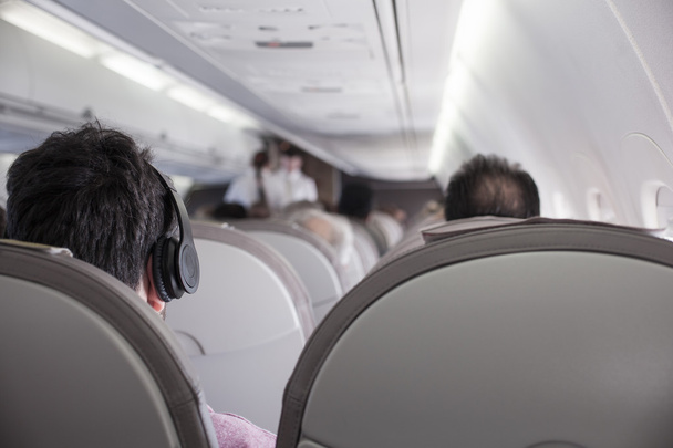 Interior of airplane with passengers  - Foto, imagen