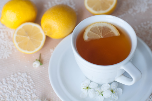 Tea with lemon in a white cup - Photo, Image