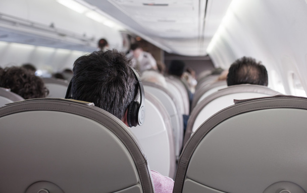 Interior of airplane with passengers  - Zdjęcie, obraz