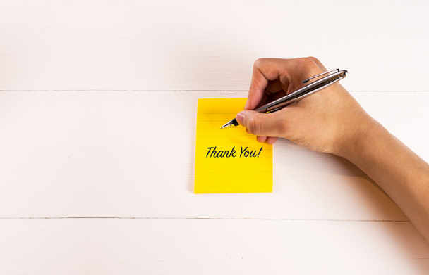 Thank you on sticky note with man hand writing - Foto, Imagem