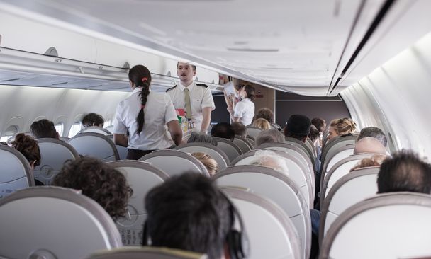 Interior of airplane with passengers  - Foto, Imagen