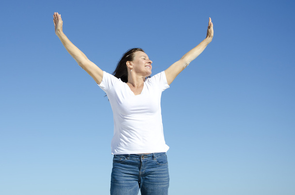 Happy cheerful woman with arms up - Foto, imagen