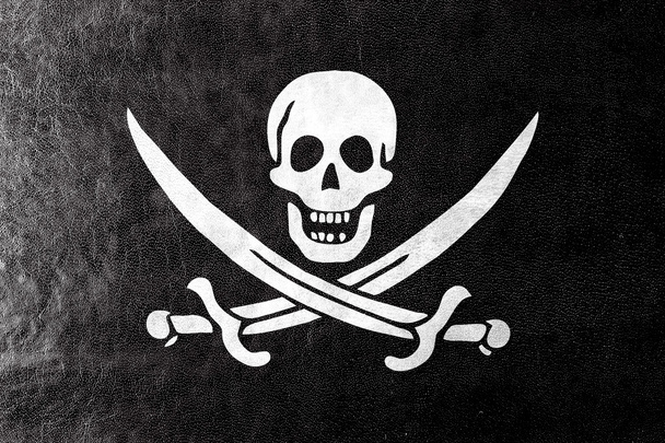 Bandiera Pirata Calico Jack, dipinta su texture in pelle
 - Foto, immagini