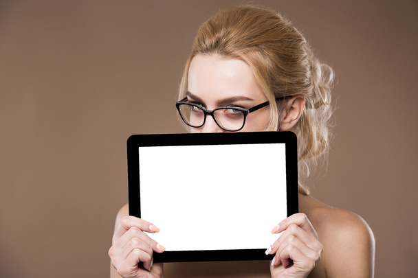 Portrait of blonde in glasses with a tablet in hands - Photo, Image
