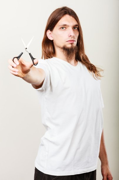 Hairstylist with scissors in hand - Valokuva, kuva