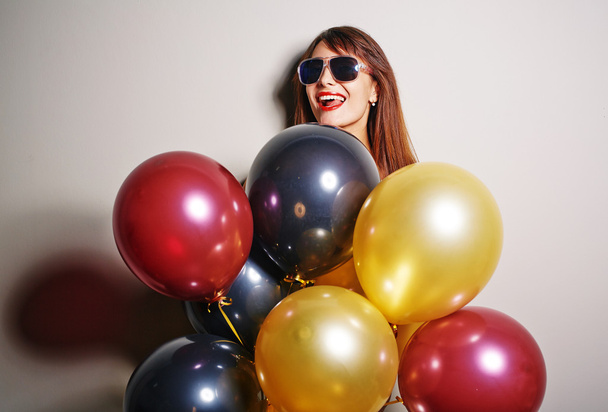 woman in sunglasses with balloons - Photo, Image