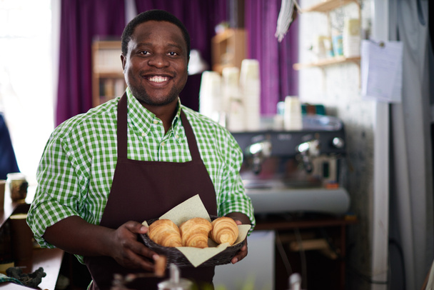 baker holding croissants - Photo, Image