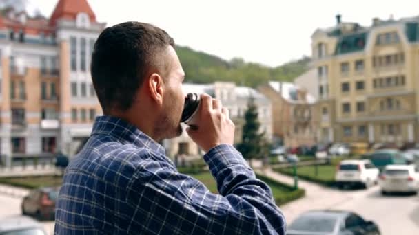 Young man outdoors with coffee - Footage, Video