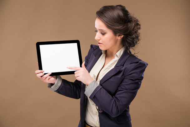 girl with a tablet in hands - Φωτογραφία, εικόνα