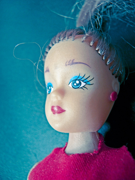 Fechar de uma boneca
 - Foto, Imagem