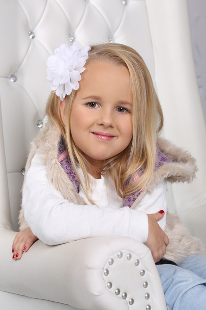 Portrait of a cute little blond girl with long hair - Zdjęcie, obraz