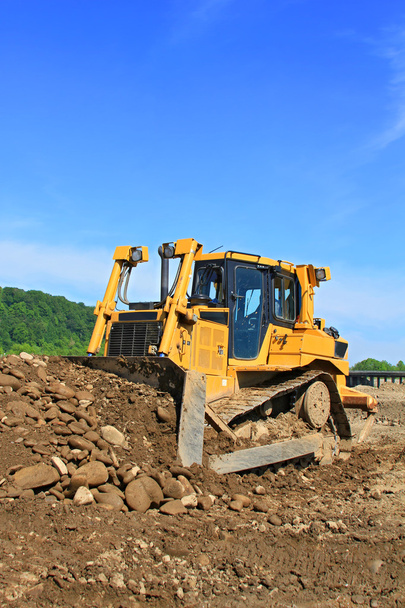 de bulldozer op een bouwplaats - Foto, afbeelding