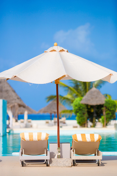 Beach chairs on exotic tropical resort - Photo, Image