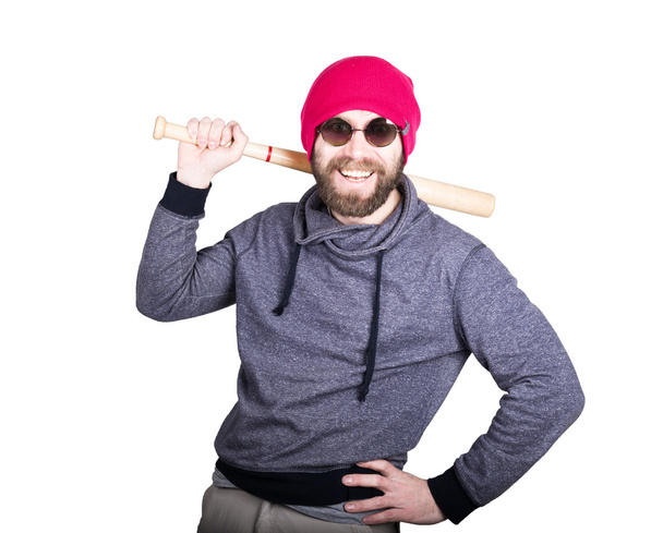 Fashion hipster cool man in sunglasses and colorful clothes brandishing a baseball bat - Фото, зображення