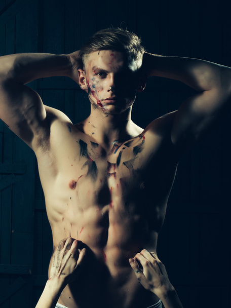 Muscular paited man and hands - Foto, afbeelding