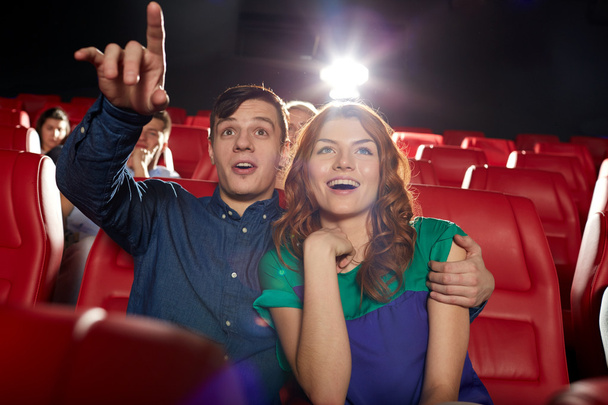 happy friends watching movie in theater - Foto, Imagen
