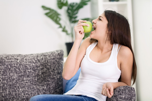 Girl eat green apple - Fotó, kép