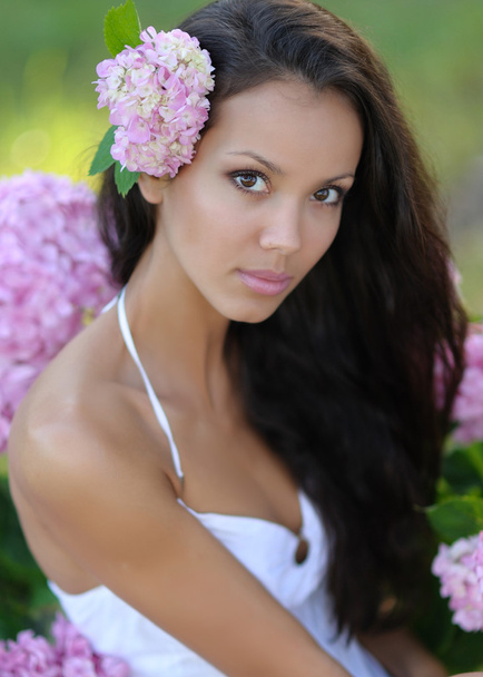 portrait of a beautiful girl with flowers in the summer - Fotografie, Obrázek