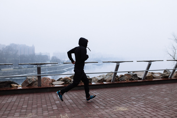 Sporty man jogging  - Valokuva, kuva
