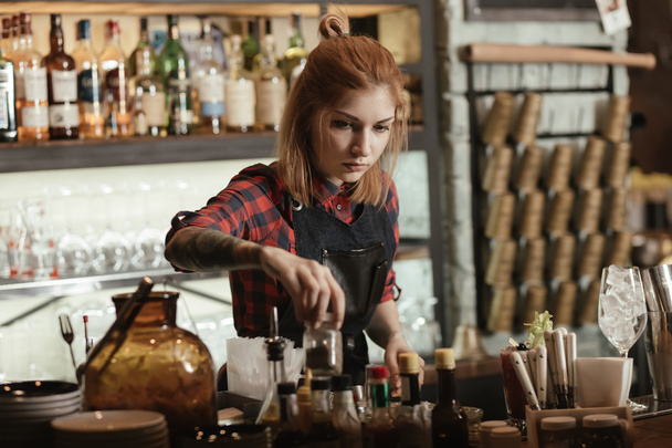 Woman bartender making cocktail  - Фото, зображення