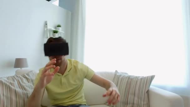 man in virtual reality headset playing game - Video
