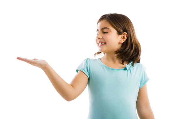 Little girl showing something - Foto, afbeelding