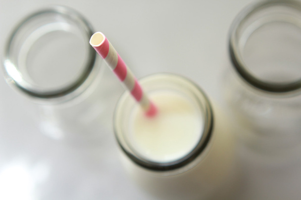 Glass, transparent bottles of fresh milk - Photo, Image