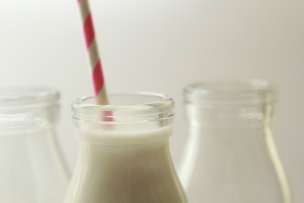 Glass, transparent bottles of fresh milk - Foto, imagen