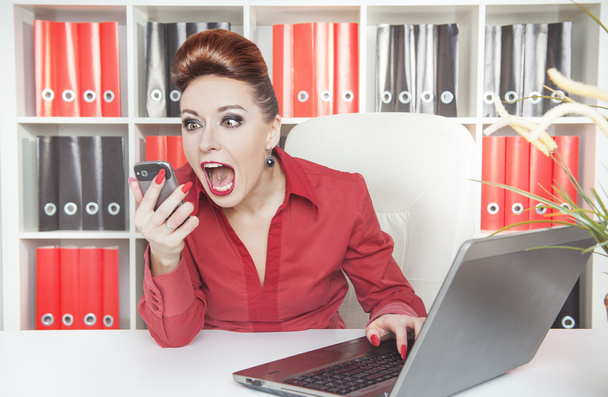 Angry screaming business woman with telephone  - Photo, Image
