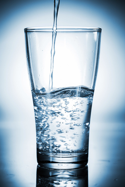 Water pouring in a glass - Zdjęcie, obraz