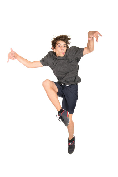 Jumping teenage boy - Фото, зображення