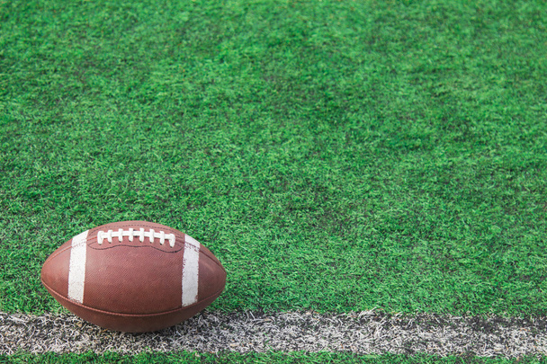 American football ball on the field - Photo, Image