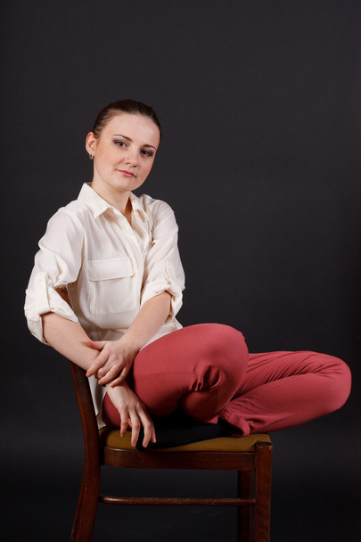 Girl with soft toys sitting on a chair - Zdjęcie, obraz
