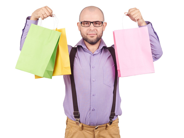 hombre con coloridas bolsas de papel de compras
 - Foto, Imagen