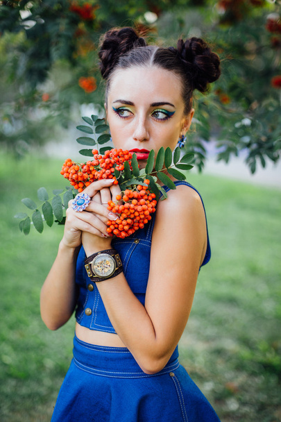 Beautiful young woman with rowan berries - Фото, зображення