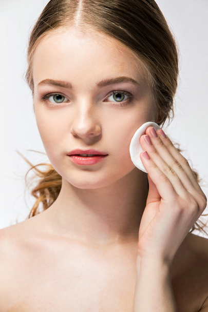 Close-up of young woman holding beauty sponge - Foto, Bild