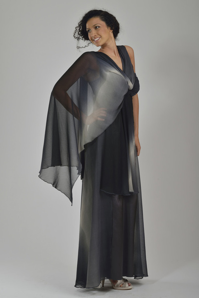 Elegant woman in fashionable dress posing in the studio - Φωτογραφία, εικόνα