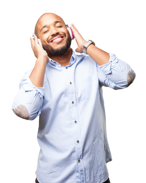 black businessman listening music on headphones - Foto, immagini