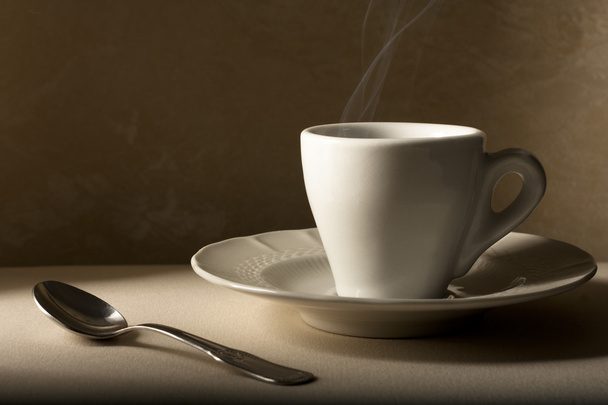 Coffee Cup and Spoon on Beige - Foto, afbeelding
