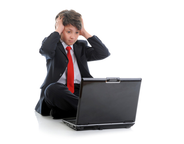 Boy in business suit sitting in front of computer - Фото, изображение