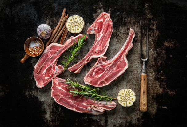 Raw fresh lamb meat on dark background - Foto, Imagen