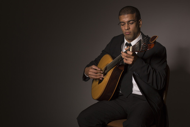 fado musician with a portuguese guitar, studio - Zdjęcie, obraz